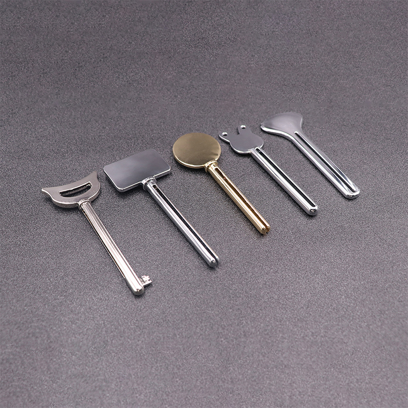 Dozator de pastă de dinți din metal Detergent facial Storcător de tuburi de pastă de dinți Forma cheie Storcator de tuburi pentru cosmetice