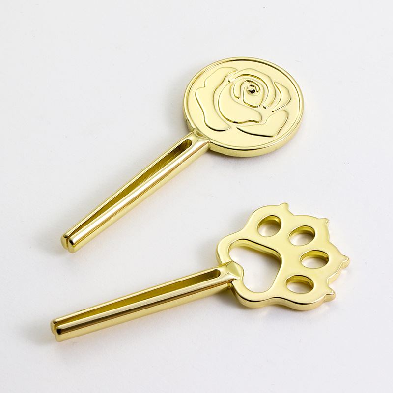 Design unic al storcător de tuburi din aliaj de zinc în formă de labe de pisică pentru mâncare pentru pisici Design unic al storcător de tuburi din aliaj de zinc în formă de labe de pisică pentru mâncare pentru pisici